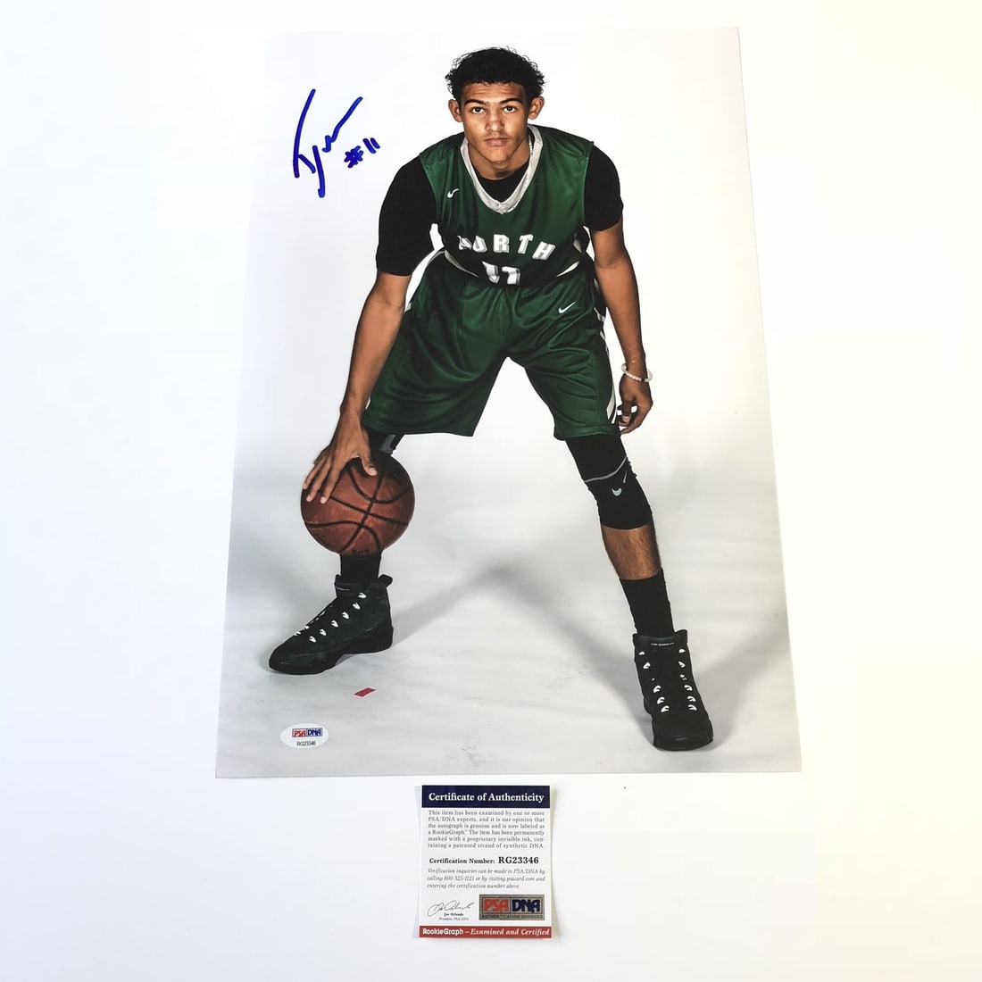 Trae Young Autographed 12x18 Photo PSA/DNA Atlanta Hawks: Trae Young Autographed 12x18 Photo PSA/DNA Atlanta Hawks Celebrate the incredible talent of Trae Young with this professionally printed 12x18 photograph, featuring his authentic signature. This item s