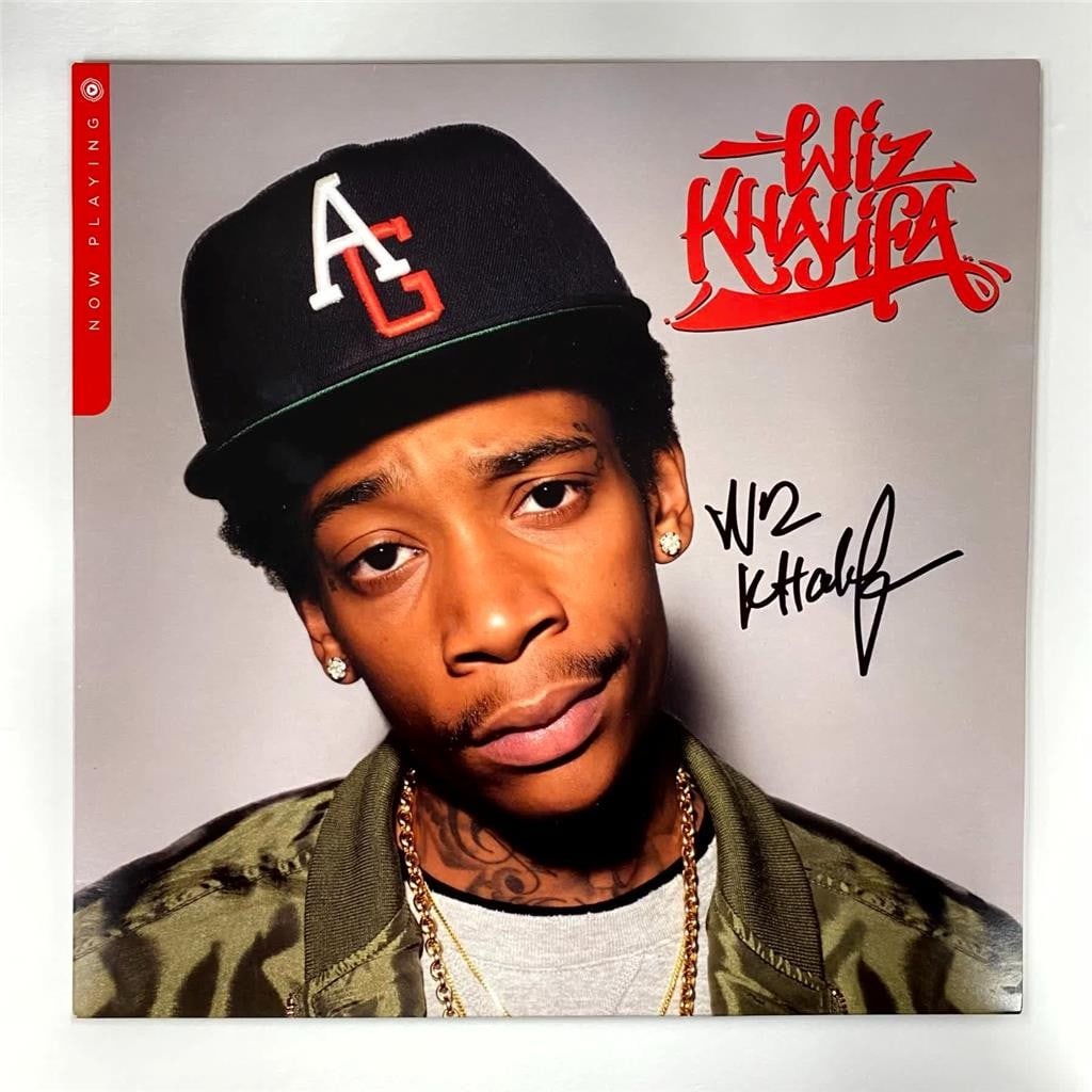 Wiz Khalifa Now Playing LP Cover Signed Beckett Authenticated Autograph: Wiz Khalifa Now Playing LP Cover Signed Beckett Authenticated Autograph This is an original Wiz Khalifa "Now Playing" vinyl record album cover, signed by Wiz Khalifa. The autograph has been authentica