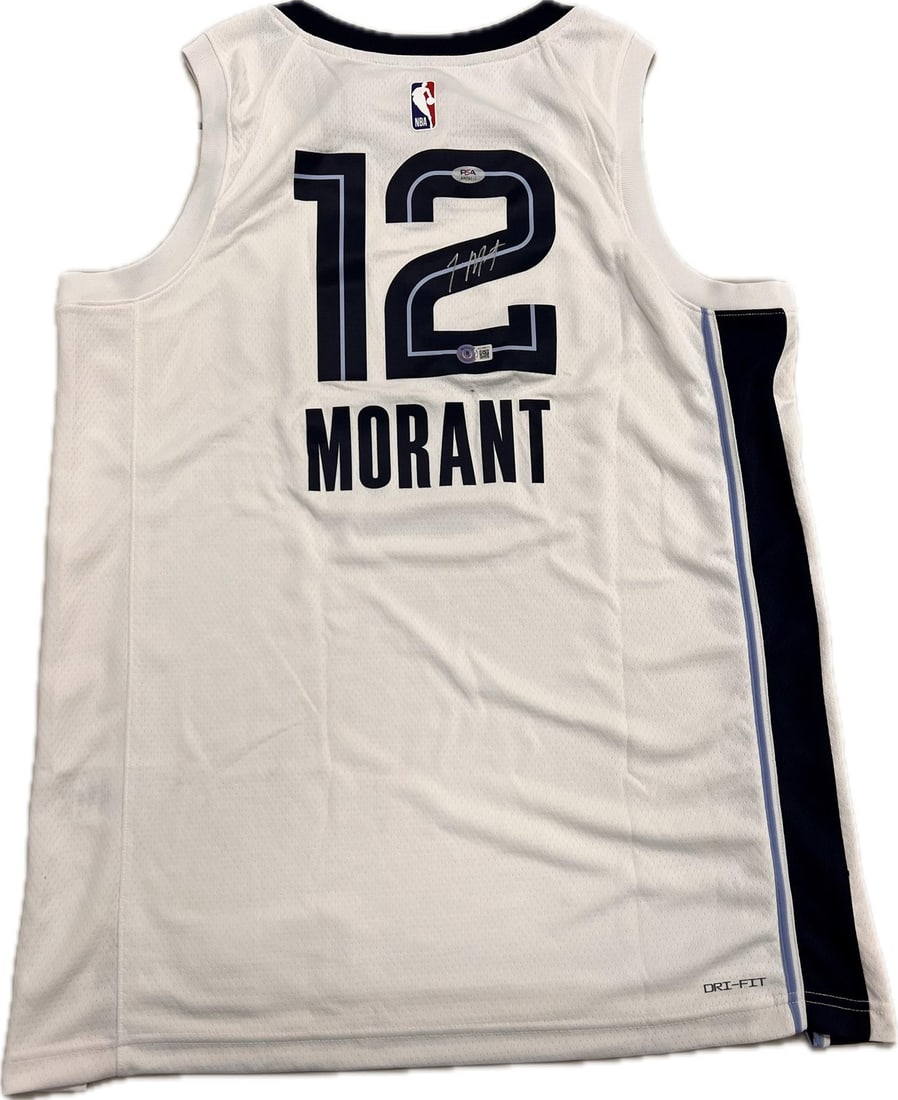Ja Morant Autographed Swingman Jersey PSA/DNA Memphis Grizzlies: Ja Morant Autographed Swingman Jersey PSA/DNA Memphis Grizzlies This is an original autographed jersey from Ja Morant, the rising star of the Memphis Grizzlies. The jersey showcases Ja Morant's signat