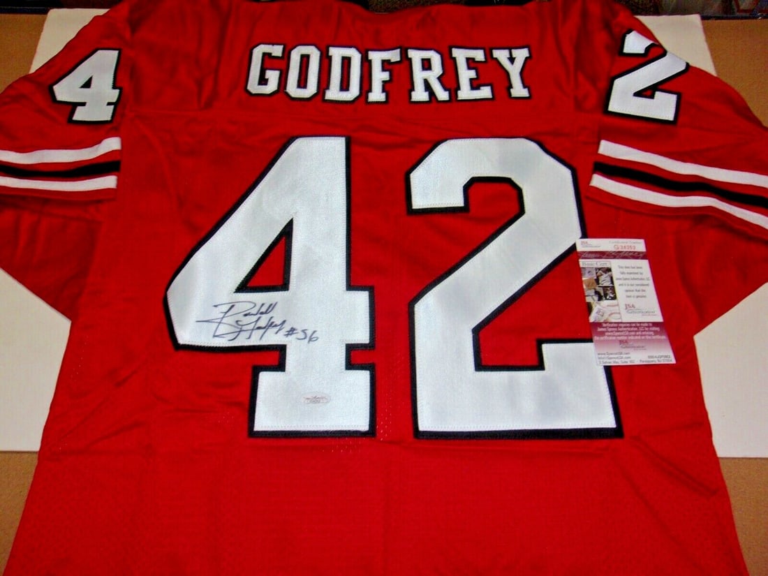 Signed Randall Godfrey Jersey Georgia Bulldogs and Cowboys JSA COA Authenticated: Signed Randall Godfrey Jersey Georgia Bulldogs and Cowboys JSA COA Authenticated This is a signed jersey featuring Randall Godfrey, associated with the Georgia Bulldogs and the Dallas Cowboys. The jer