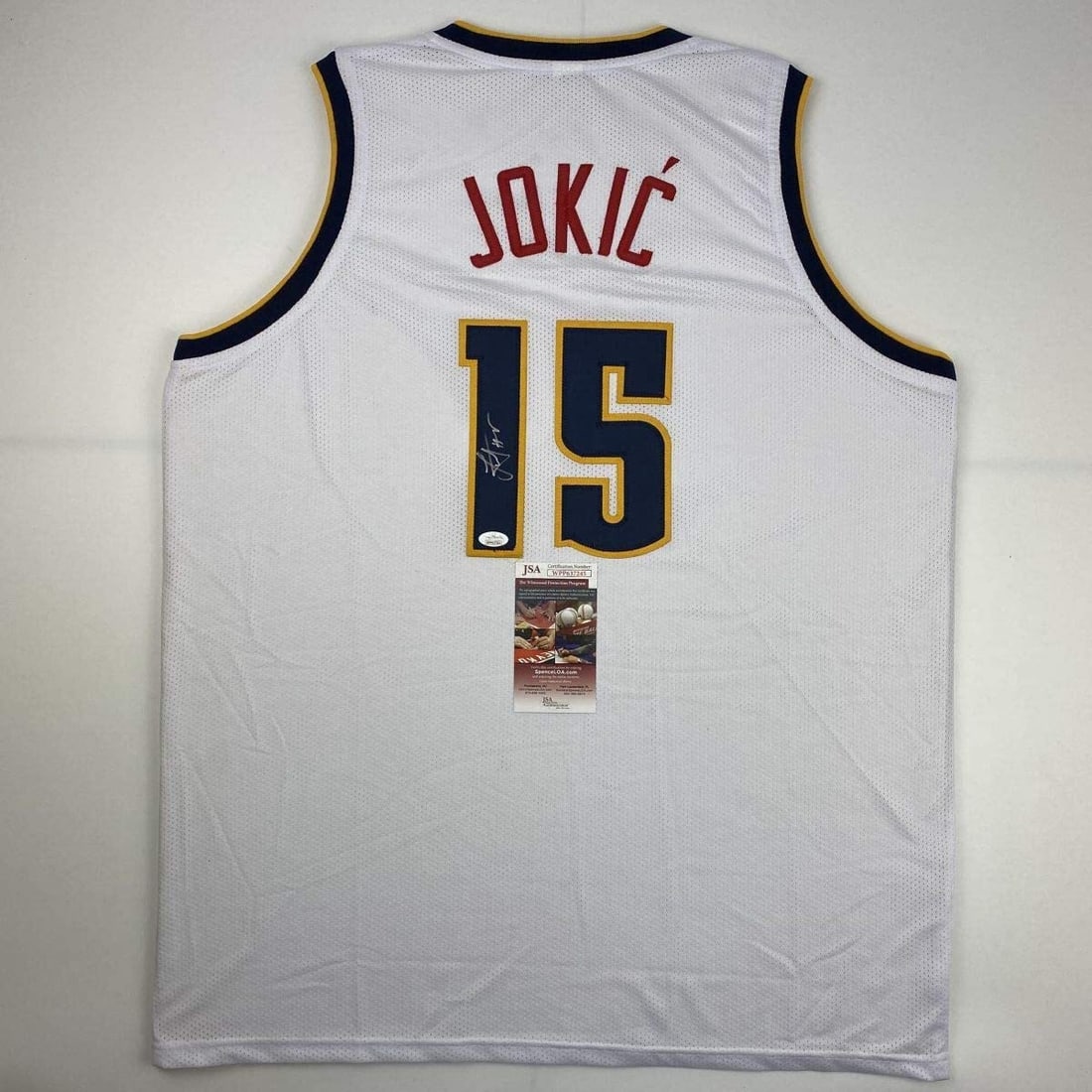 Signed Nikola Jokic Denver Nuggets Basketball Jersey JSA COA: Signed Nikola Jokic Denver Nuggets Basketball Jersey JSA COA Own a piece of NBA memorabilia with this autographed Nikola Jokic Denver White Basketball Jersey. This custom jersey features the name and 