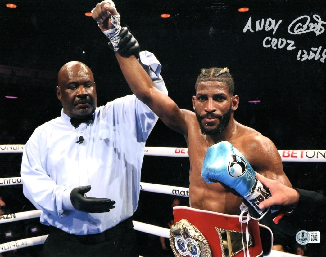 Andy Cruz Autographed 11x14 Boxing Photo Post Fight Beckett Authenticated: Andy Cruz Autographed 11x14 Boxing Photo Post Fight Beckett Authenticated Celebrate boxing history with this authentic Andy Cruz signed 11X14 photo capturing his post-fight victory at 135 lbs. This or