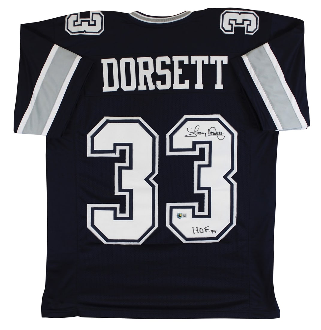 Tony Dorsett Signed Dallas Cowboys Navy Jersey HOF 94 BAS Witnessed: Tony Dorsett Signed Dallas Cowboys Navy Jersey HOF 94 BAS Witnessed Own a piece of football history with this authentic, signed navy Pro Style Jersey by Tony Dorsett, featuring the inscription "HOF 94