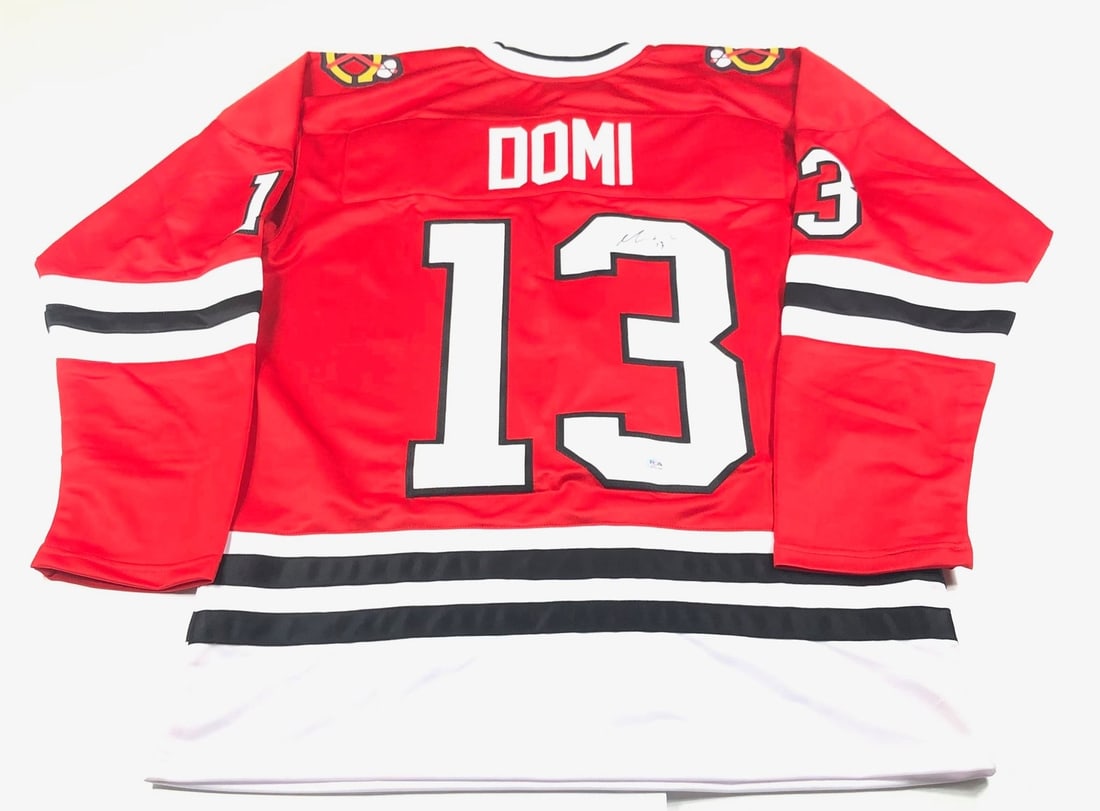 Max Domi Chicago Blackhawks Autographed Jersey PSA/DNA Authentic: Max Domi Chicago Blackhawks Autographed Jersey PSA/DNA Authentic This is an original Chicago Blackhawks jersey autographed by Max Domi, a prominent player in the NHL. The authenticity of the signature