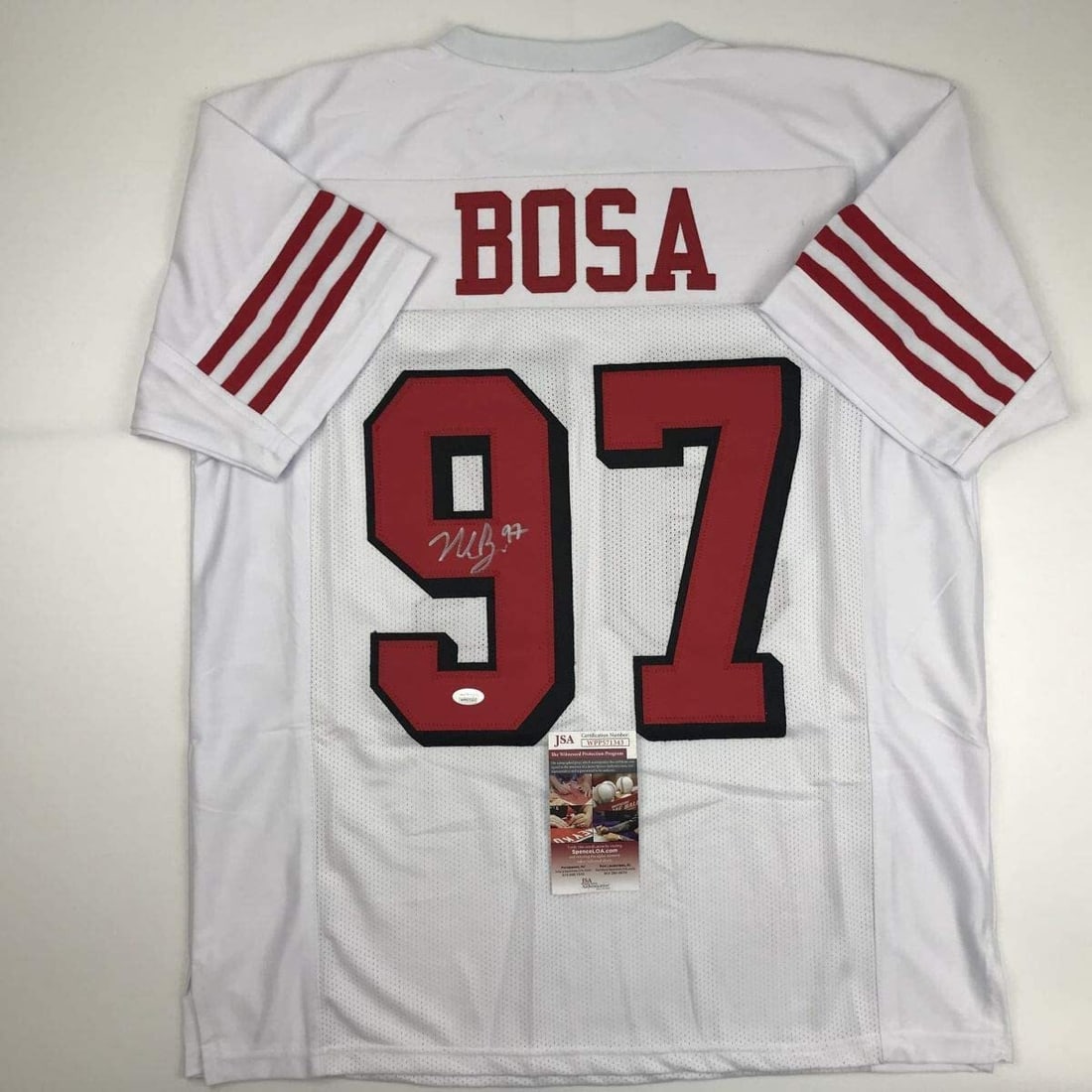 Nick Bosa Signed Custom White Jersey San Francisco JSA Authenticated: Nick Bosa Signed Custom White Jersey San Francisco JSA Authenticated This autographed Nick Bosa San Francisco white football jersey is a custom collectible, featuring the player's name and number. The