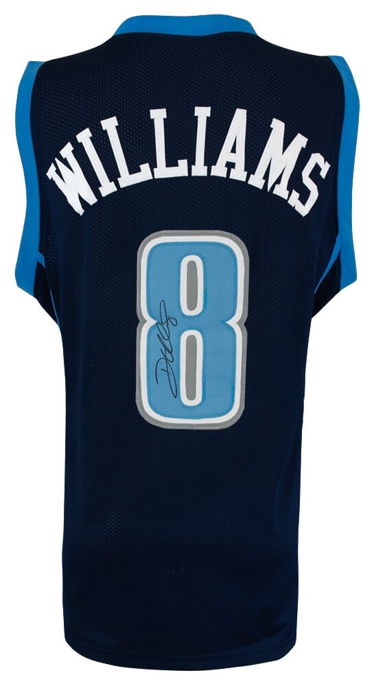 Navy Custom Utah Jazz Jersey Signed by Deron Williams: Navy Custom Utah Jazz Jersey Signed by Deron Williams This navy custom basketball jersey is signed by Deron Williams, a former Utah Jazz NBA player. The jersey includes a tamper-proof numbered hologra