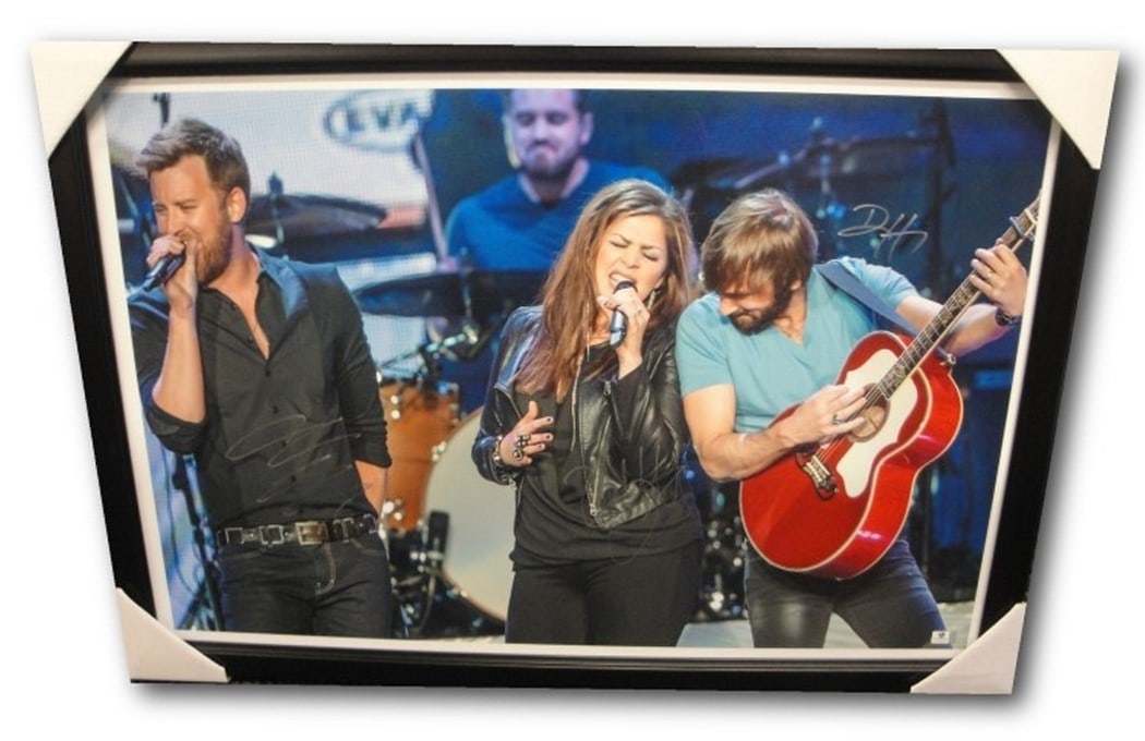 Lady Antebellum Autographed 20x30 Photo Custom Framed GAI Authenticated: Lady Antebellum Autographed 20x30 Photo Custom Framed GAI Authenticated This is an original 20x30 photo autographed by the members of Lady Antebellum: Hillary Scott, Charles Kelley, and Dave Haywood. 