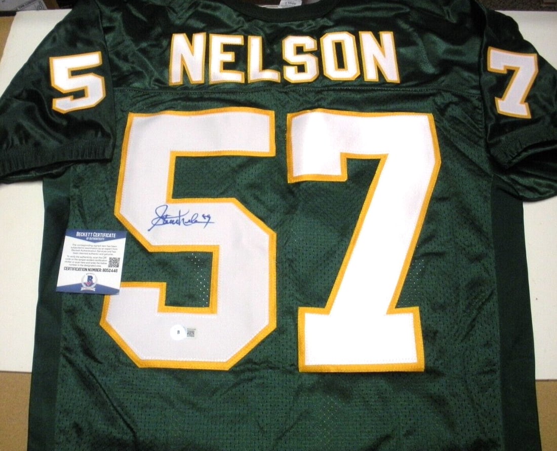 Rawlings Football Jersey Signed by Steve Nelson with Beckett COA: Rawlings Football Jersey Signed by Steve Nelson with Beckett COA This pre-owned official licensed Rawlings football jersey has been signed by Steve Nelson of North Dakota. The autograph is accompanied