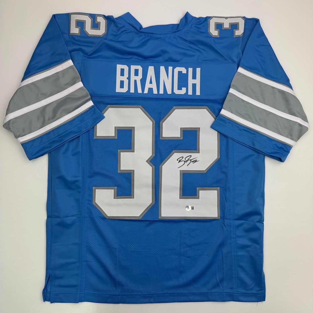 Signed Brian Branch Detroit Lions Blue Football Jersey Beckett BAS COA: Signed Brian Branch Detroit Lions Blue Football Jersey Beckett BAS COA This autographed Brian Branch Detroit Lions football jersey is a unique collectible for fans and collectors alike. The jersey fea