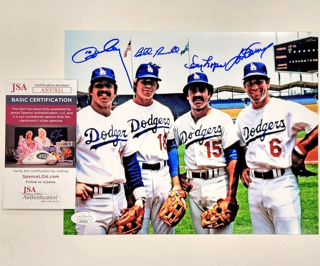 Los Angeles Dodgers Infield Signed 8x10 Photo JSA Authenticated Garvey Russell Lopes Cey: Los Angeles Dodgers Infield Signed 8x10 Photo JSA Authenticated Garvey Russell Lopes Cey This is an original 8x10 photo featuring the Los Angeles Dodgers infield, autographed by renowned players Steve