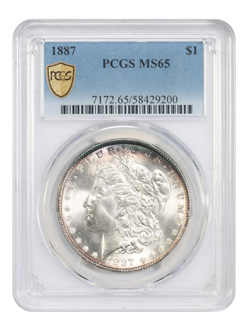 PCGS MS65 1887 Morgan Silver Dollar: PCGS MS65 1887 Morgan Silver Dollar This is an 1887 Morgan Dollar graded MS65 by PCGS. The coin is uncirculated and was minted in Philadelphia. It is part of the Morgan Dollar series and is categorize
