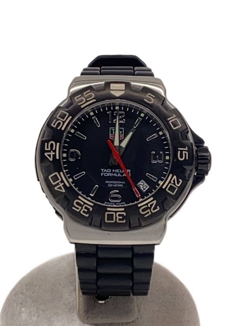 TAG HEUER Formula 1 Quartz Black Men's Wristwatch WAC1110: TAG HEUER Formula 1 Quartz Black Men's Wristwatch WAC1110 This TAG HEUER Formula 1 Quartz WAC1110 men's wristwatch features a black case and dial. The watch is Swiss-made and designed for men. It is a
