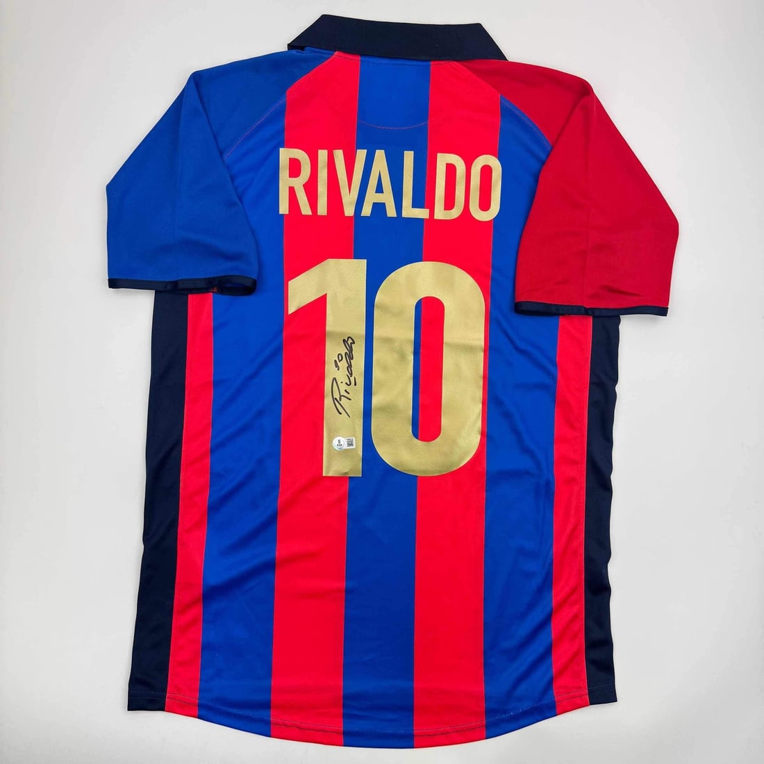 Rivaldo Ferreira Signed FC Barcelona Blue Jersey Beckett BAS Certified: Rivaldo Ferreira Signed FC Barcelona Blue Jersey Beckett BAS Certified This is an authentic autographed blue jersey of Rivaldo Ferreira, a renowned player from FC Barcelona. The jersey is officially g