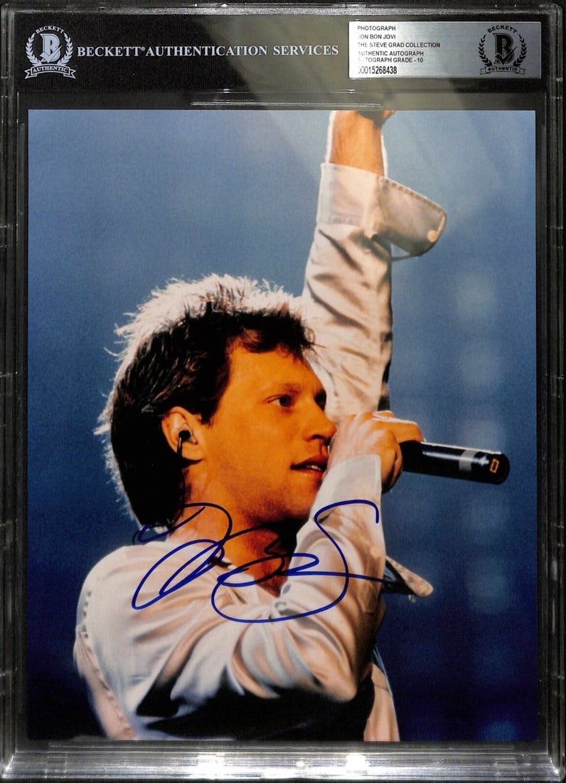 Jon Bon Jovi Signed 8x10 Photo Auto Grade 10 Beckett: Jon Bon Jovi Signed 8x10 Photo Auto Grade 10 Beckett This is an autographed 8x10 color photograph of musician Jon Bon Jovi, signed in blue permanent marker. The signature has been authenticated and gr