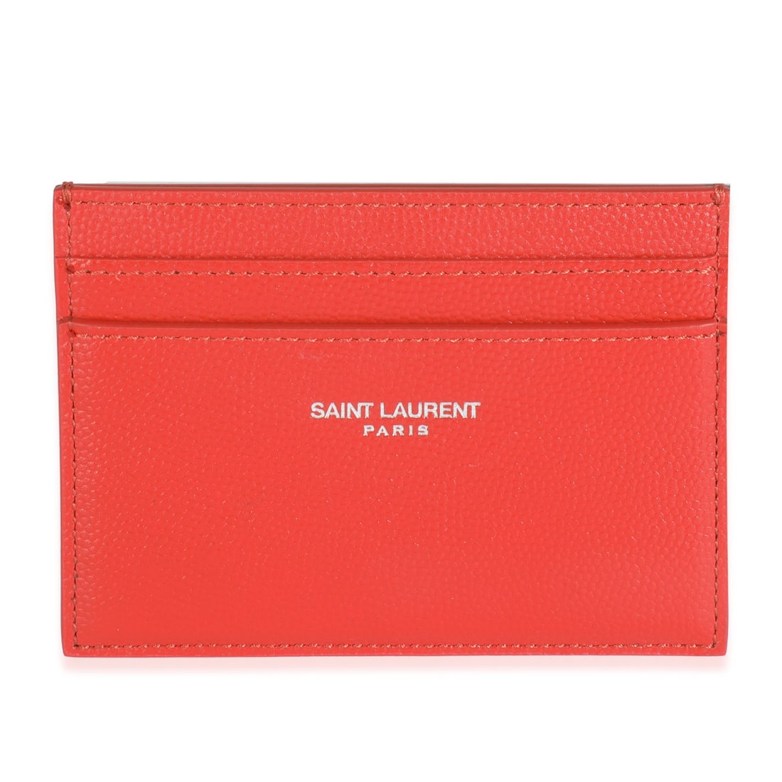 Red Leather Grain De Poudre Card Holder by Saint Laurent: Red Leather Grain De Poudre Card Holder by Saint Laurent This Saint Laurent grain de poudre credit card case features a red leather exterior with an open top design. It is crafted in Italy and is suit