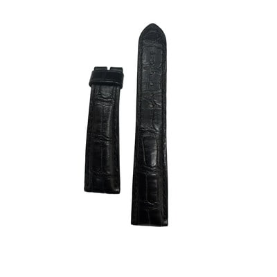 Breguet Black Leather Two Piece Watch Strap: Breguet Black Leather Two Piece Watch Strap This pre-owned Breguet men's watch strap is crafted from black leather with a crocodile pattern. It is in excellent condition, showing only very light signs
