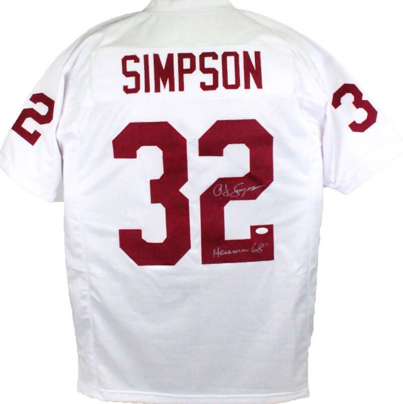OJ Simpson Signed USC Trojans College Jersey with Heisman JSA Authentication: OJ Simpson Signed USC Trojans College Jersey with Heisman JSA Authentication This is an original white college style jersey signed by O.J. Simpson, featuring his notable Heisman Trophy inscription. Th