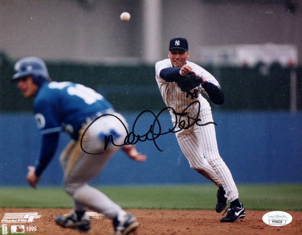 Derek Jeter Signed 8X10 Photo Yankees 1999 JSA Authenticated: Derek Jeter Signed 8X10 Photo Yankees 1999 JSA Authenticated This is an original 8x10 photograph of Derek Jeter, the legendary New York Yankees player, showcasing him in a throwing pose. The photo is 
