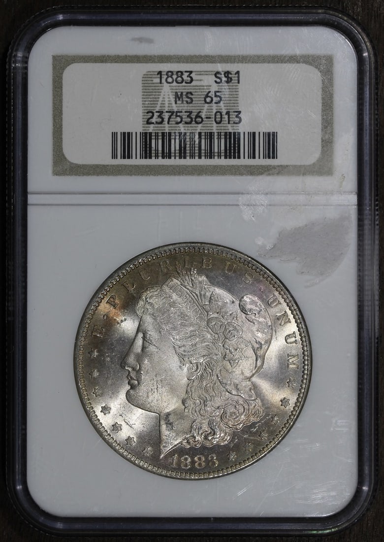 NGC MS65 1883 Morgan Silver Dollar Philadelphia Mint: NGC MS65 1883 Morgan Silver Dollar Philadelphia Mint This 1883 Morgan Silver Dollar is graded MS65 by NGC, indicating a high-quality, uncirculated condition. Struck in Philadelphia, it features a comp