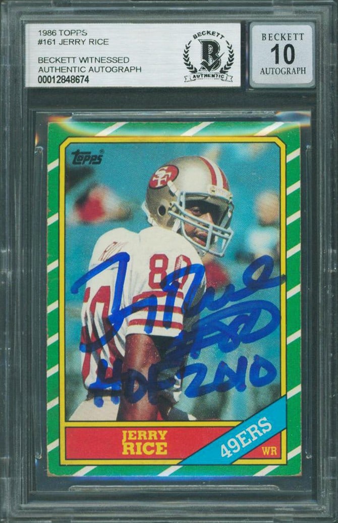 Jerry Rice Signed 1986 Topps RC Card HOF 2010 Beckett Authenticated: Jerry Rice Signed 1986 Topps RC Card HOF 2010 Beckett Authenticated Celebrate football history with this autographed 1986 Topps #161 rookie card of Jerry Rice, featuring the inscription "HOF 2010." Gr