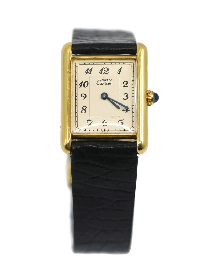 Cartier Tank 590005 Sterling Silver Vermeil Quartz Leather Wristwatch: Cartier Tank 590005 Sterling Silver Vermeil Quartz Leather Wristwatch This Cartier Tank Vermeil wristwatch features a sterling silver case and a leather band. Designed for unisex adults, it operates w