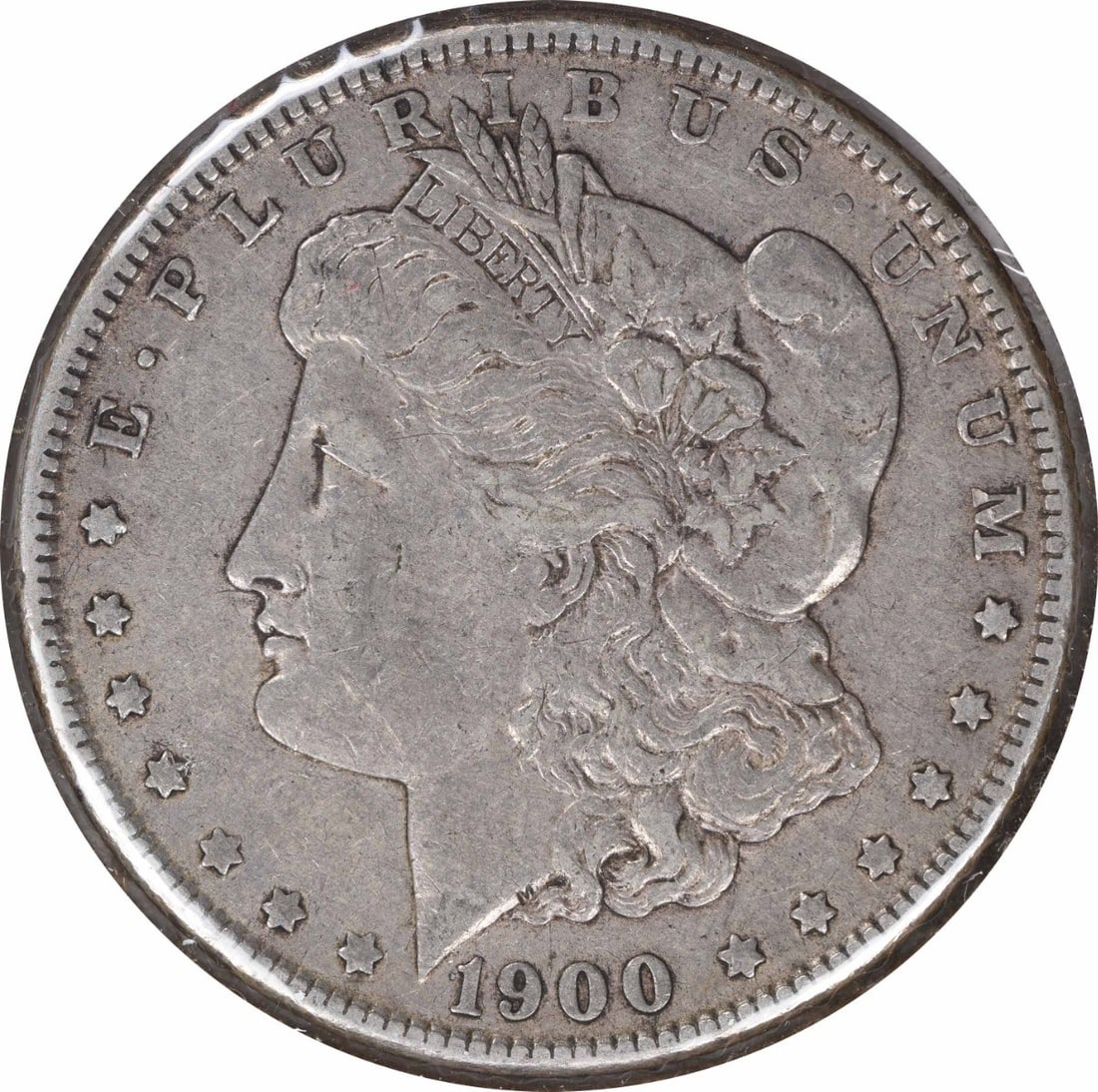 1900-O Morgan Silver Dollar VF Uncertified 90% Silver Coin: 1900-O Morgan Silver Dollar VF Uncertified 90% Silver Coin This 1900-O/CC Morgan Silver Dollar is a remarkable piece for any collector, showcasing the artistry of designer George T. Morgan. With a gra