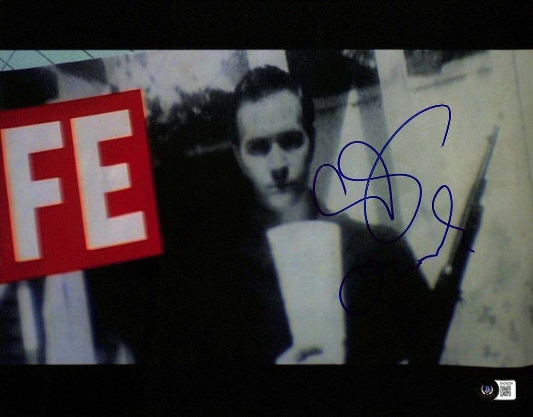 Gary Oldman Autographed 11x14 Photo as Lee Harvey Oswald in JFK Beckett Authenticated: Gary Oldman Autographed 11x14 Photo as Lee Harvey Oswald in JFK Beckett Authenticated This is an autographed 11x14 photograph featuring Gary Oldman as Lee Harvey Oswald from the movie JFK. The photogr