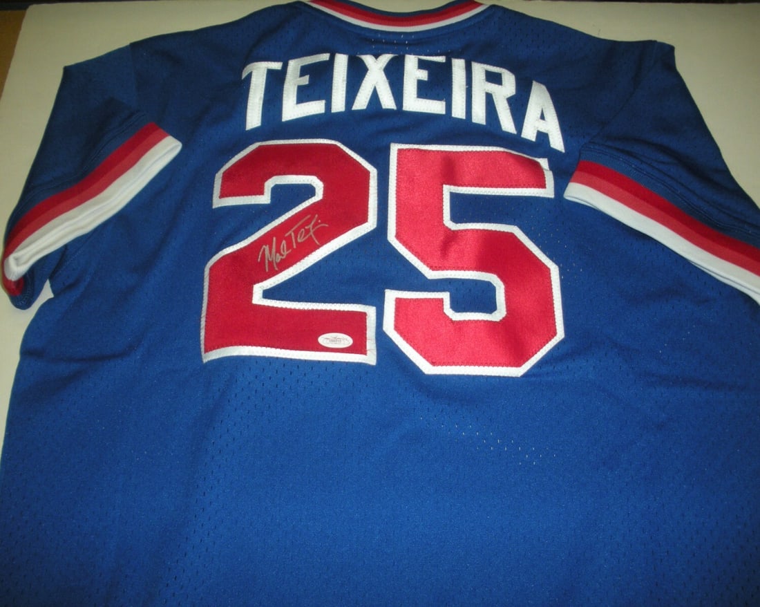 Mitchell & Ness Atlanta Braves Jersey Signed by Mark Teixeira JSA COA: Mitchell & Ness Atlanta Braves Jersey Signed by Mark Teixeira JSA COA This is a pre-owned, officially licensed Mitchell & Ness jersey signed by Mark Teixeira of the Atlanta Braves. The jersey is an or