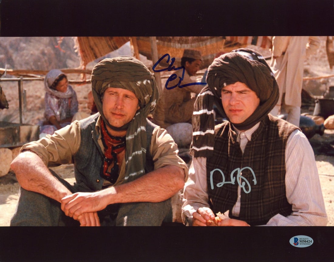 11x14 Photograph Signed by Chevy Chase and Dan Aykroyd Beckett Witnessed COA: 11x14 Photograph Signed by Chevy Chase and Dan Aykroyd Beckett Witnessed COA This 11x14 photograph features a sitting pose from the film 'Spies Like Us' and has been personally signed by Chevy Chase a