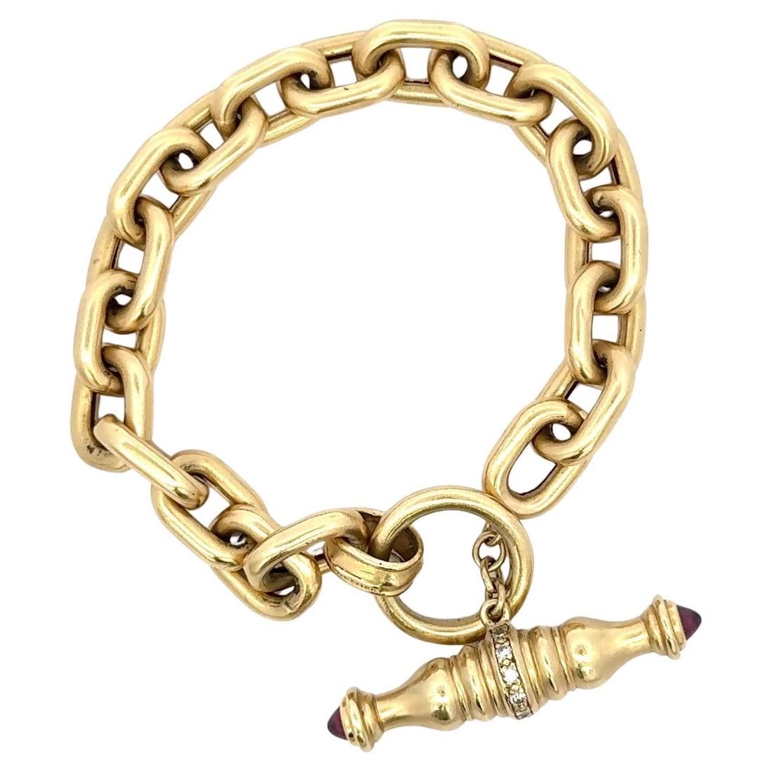 Seidengang 18KT Yellow Gold Diamond Garnet Toggle Bracelet 32g 7.5in: Seidengang 18KT Yellow Gold Diamond Garnet Toggle Bracelet 32g 7.5in This stunning 18 karat yellow gold bracelet showcases a contemporary oval link design, enhanced by a decorative toggle clasp. Weigh