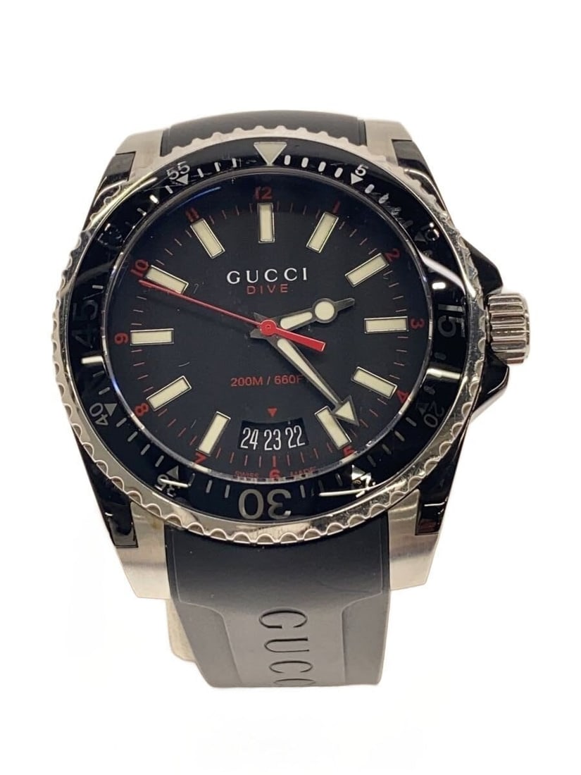 Gucci Dive Black Rubber Quartz Men's Wristwatch Box Manual: Gucci Dive Black Rubber Quartz Men's Wristwatch Box Manual This is a pre-owned GUCCI DIVE Quartz 136.3 men's wristwatch featuring a black dial and a durable rubber strap. The watch shows slight signs 