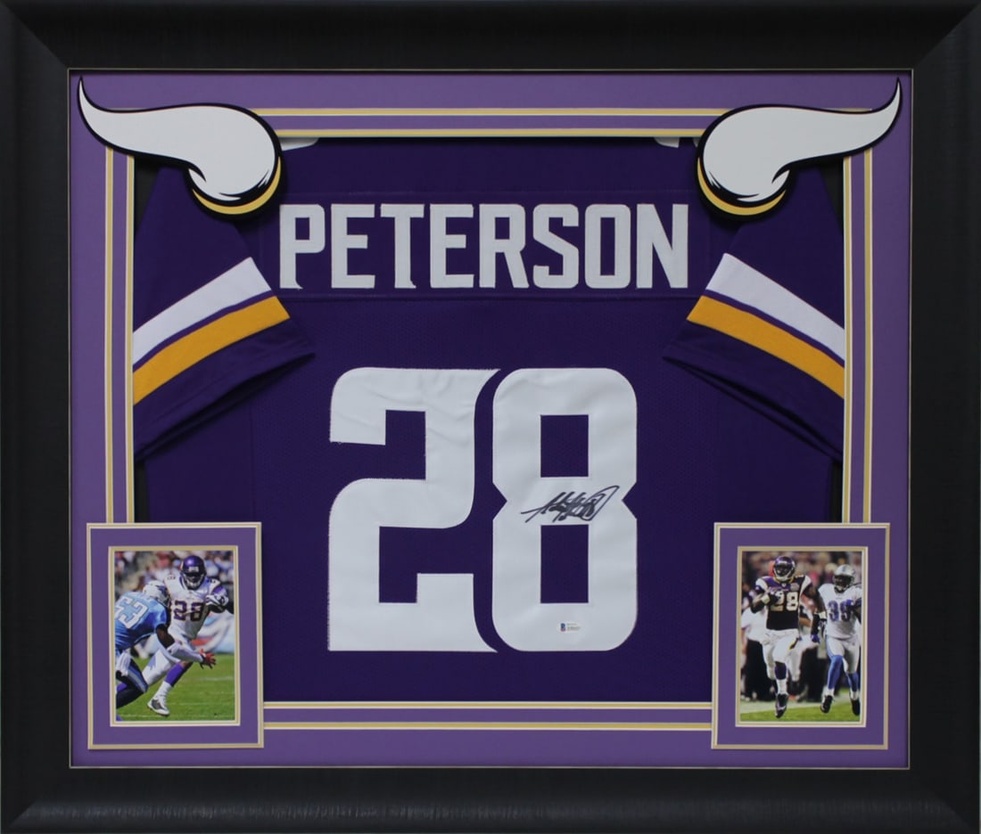 Framed Adrian Peterson Signed Jersey With Beckett QR Hologram Authentication: Framed Adrian Peterson Signed Jersey With Beckett QR Hologram Authentication This professionally framed purple Pro Style jersey has been personally signed by Adrian Peterson of the Minnesota Vikings. 