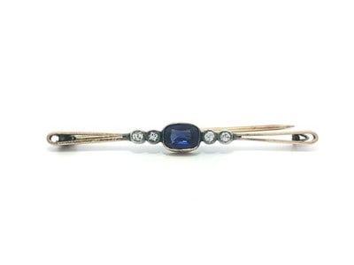 Antique Gold Silver Bar Pin Brooch Blue Cushion Stone White Accents: Antique Gold Silver Bar Pin Brooch Blue Cushion Stone White Accents This antique bar pin brooch features a striking cushion-cut blue stone at its center, accented by four round white stones. Crafted f