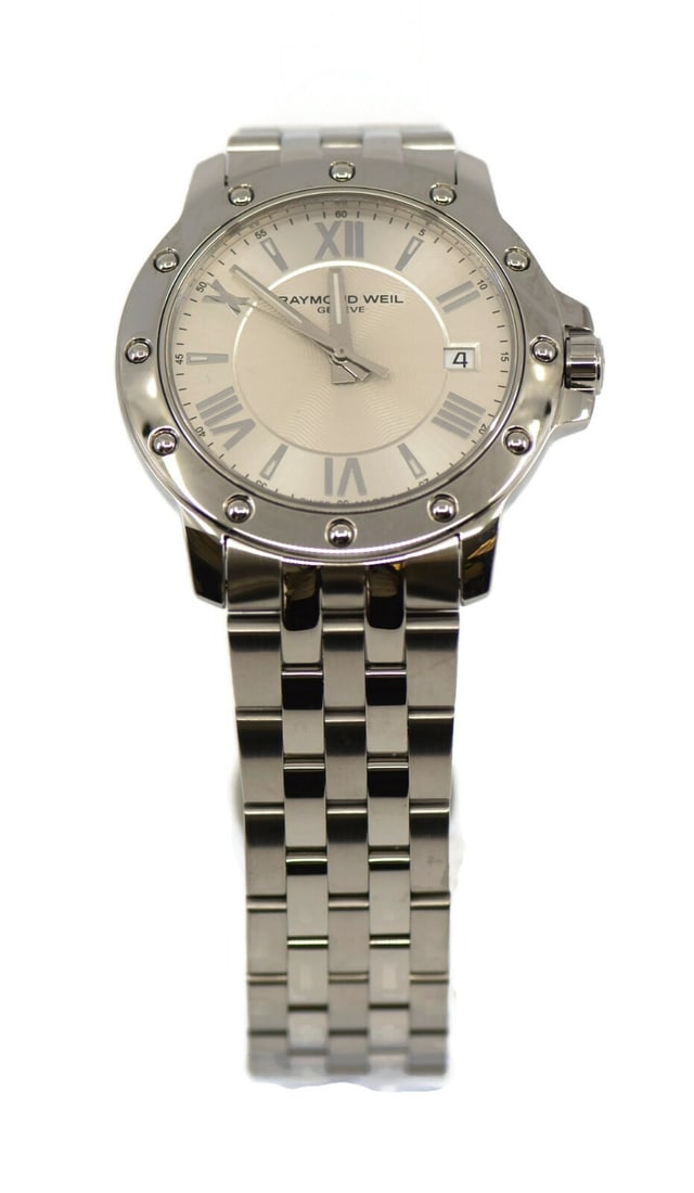 Raymond Weil Tango 5399 Stainless Steel Wristwatch Silver Dial: Raymond Weil Tango 5399 Stainless Steel Wristwatch Silver Dial Discover the elegance of the Raymond Weil Tango Wristwatch, a perfect blend of style and functionality. This pre-owned timepiece features