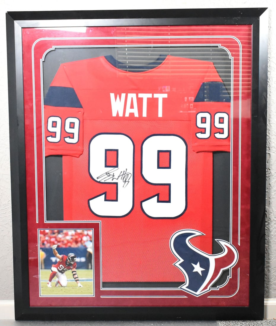 Houston Texans Red Jersey Signed by JJ Watt in Glass Frame JSA Authenticated: Houston Texans Red Jersey Signed by JJ Watt in Glass Frame JSA Authenticated This glass-framed red pro style jersey features the authentic signature of JJ Watt, the renowned football player. Represent