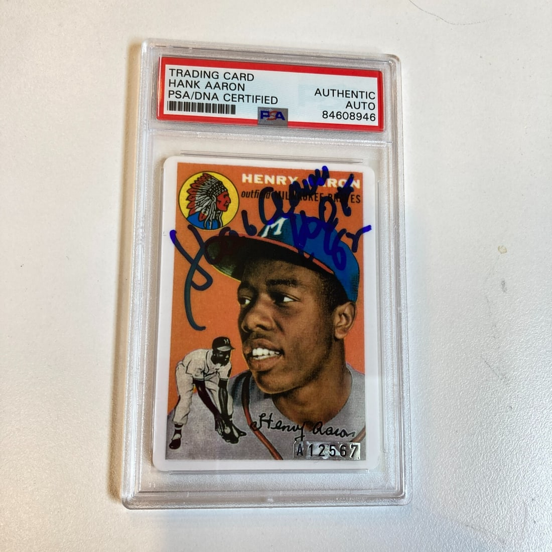1954 Topps Hank Aaron Rookie Card PSA Signed Baseball Card: 1954 Topps Hank Aaron Rookie Card PSA Signed Baseball Card This collectible features a 1954 Topps Hank Aaron Rookie Card, distinguished by its signature from the legendary player himself. It is a hard