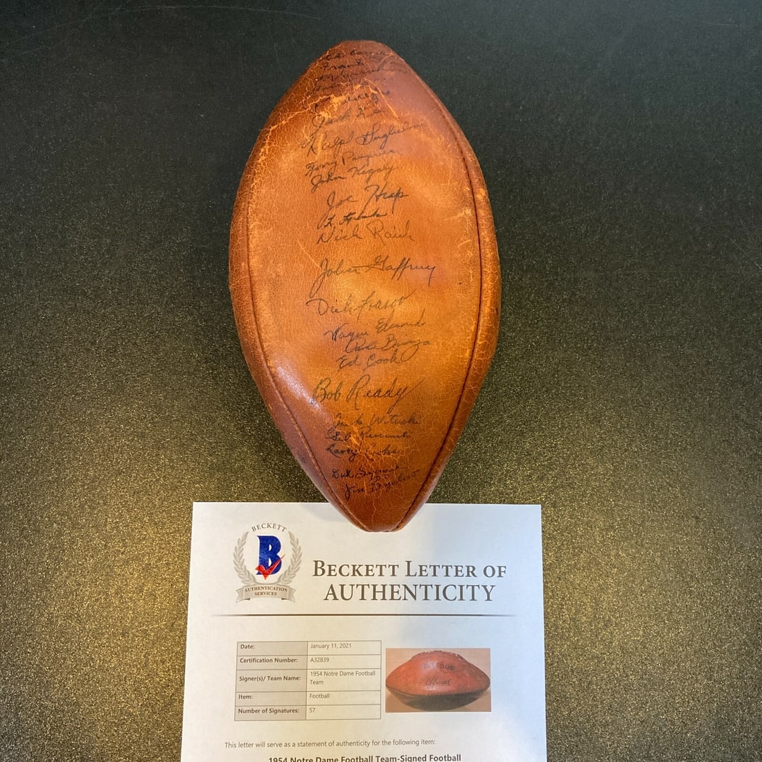 Notre Dame 1954 Football Autographed by 57 Players with Beckett Letter: Notre Dame 1954 Football Autographed by 57 Players with Beckett Letter This is an original 1954 Notre Dame Fighting Irish football, team-signed by 57 members including notable names such as Paul Hornu