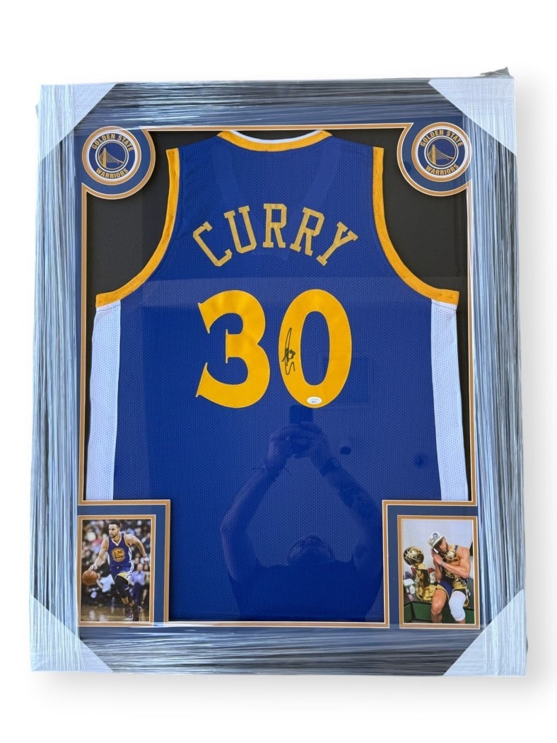 Framed Golden State Warriors Steph Curry Signed Jersey JSA Authenticated: Framed Golden State Warriors Steph Curry Signed Jersey JSA Authenticated This is a custom-framed Golden State Warriors away jersey autographed by Steph Curry. The jersey is authenticated by James Spen