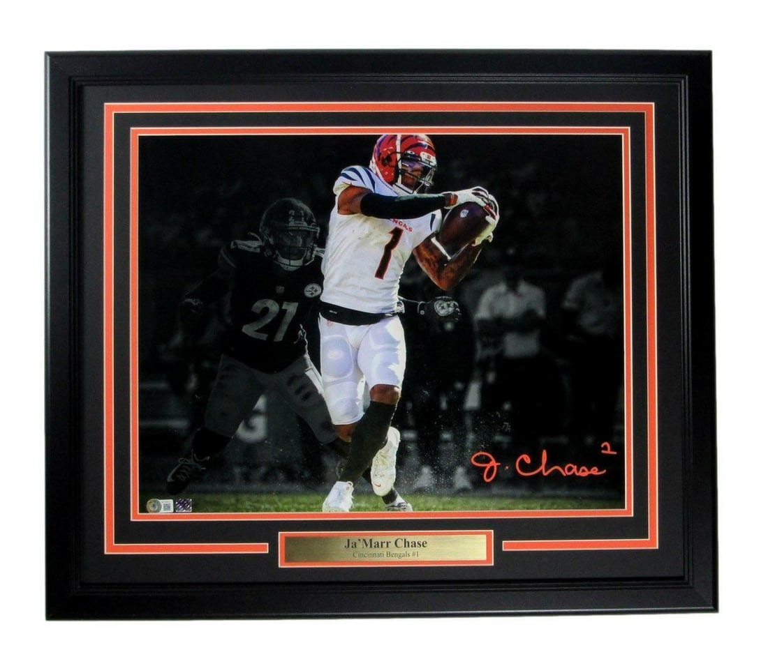 Framed 16x20 Ja'Marr Chase Autographed Cincinnati Bengals Photo Beckett Authenticated: Framed 16x20 Ja'Marr Chase Autographed Cincinnati Bengals Photo Beckett Authenticated This framed 16x20 photo features Ja'Marr Chase of the Cincinnati Bengals and includes his authentic signature. The