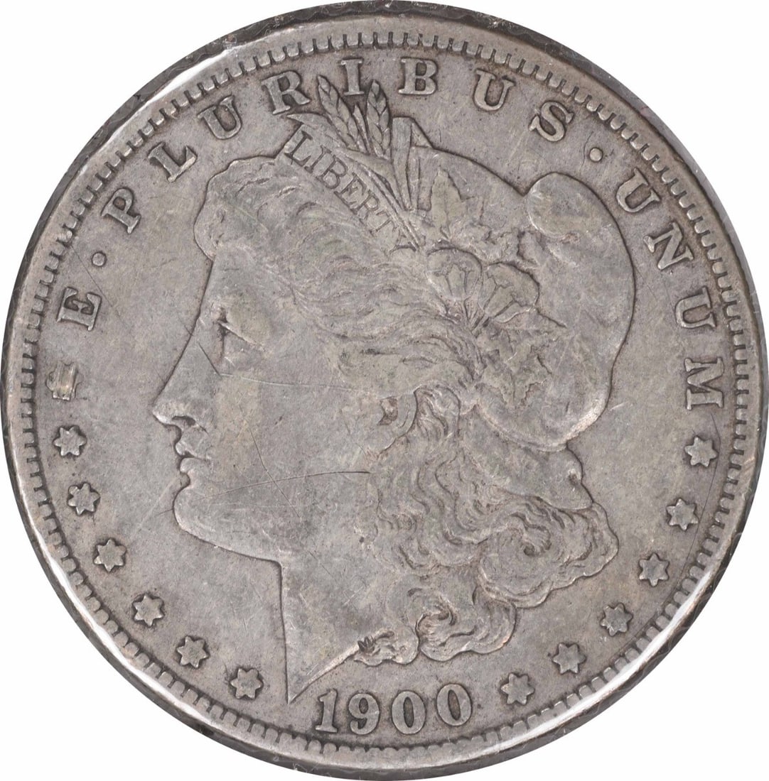 1900-O Morgan Silver Dollar VF Uncertified 90% Silver Coin: 1900-O Morgan Silver Dollar VF Uncertified 90% Silver Coin This 1900-O/CC Morgan Silver Dollar is a remarkable piece of numismatic history. Struck in 90% silver and 10% copper, this coin showcases the