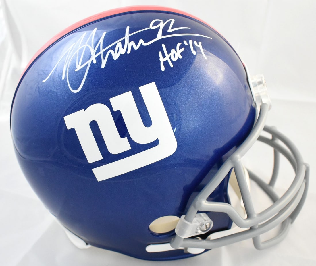Autographed Full Size New York Giants Helmet by Michael Strahan with HOF Inscription: Autographed Full Size New York Giants Helmet by Michael Strahan with HOF Inscription This full-size New York Giants helmet features the autograph of Michael Strahan, accompanied by a Hall of Fame insc