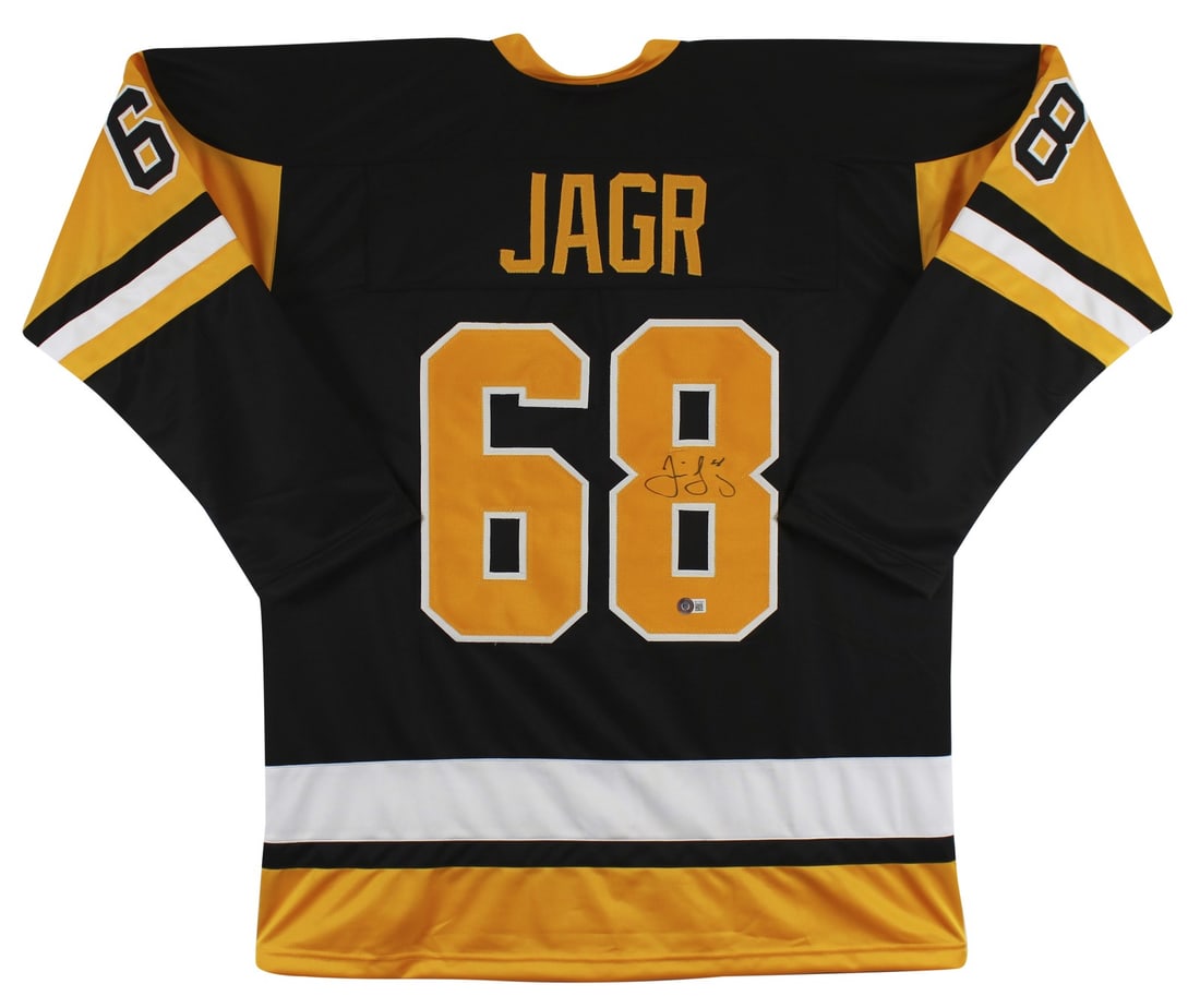 Jaromir Jagr Signed Black Jersey with Yellow Numbers Beckett Authenticated: Jaromir Jagr Signed Black Jersey with Yellow Numbers Beckett Authenticated This authentic black pro style jersey, featuring yellow numbers, has been personally signed by NHL legend Jaromir Jagr, renow