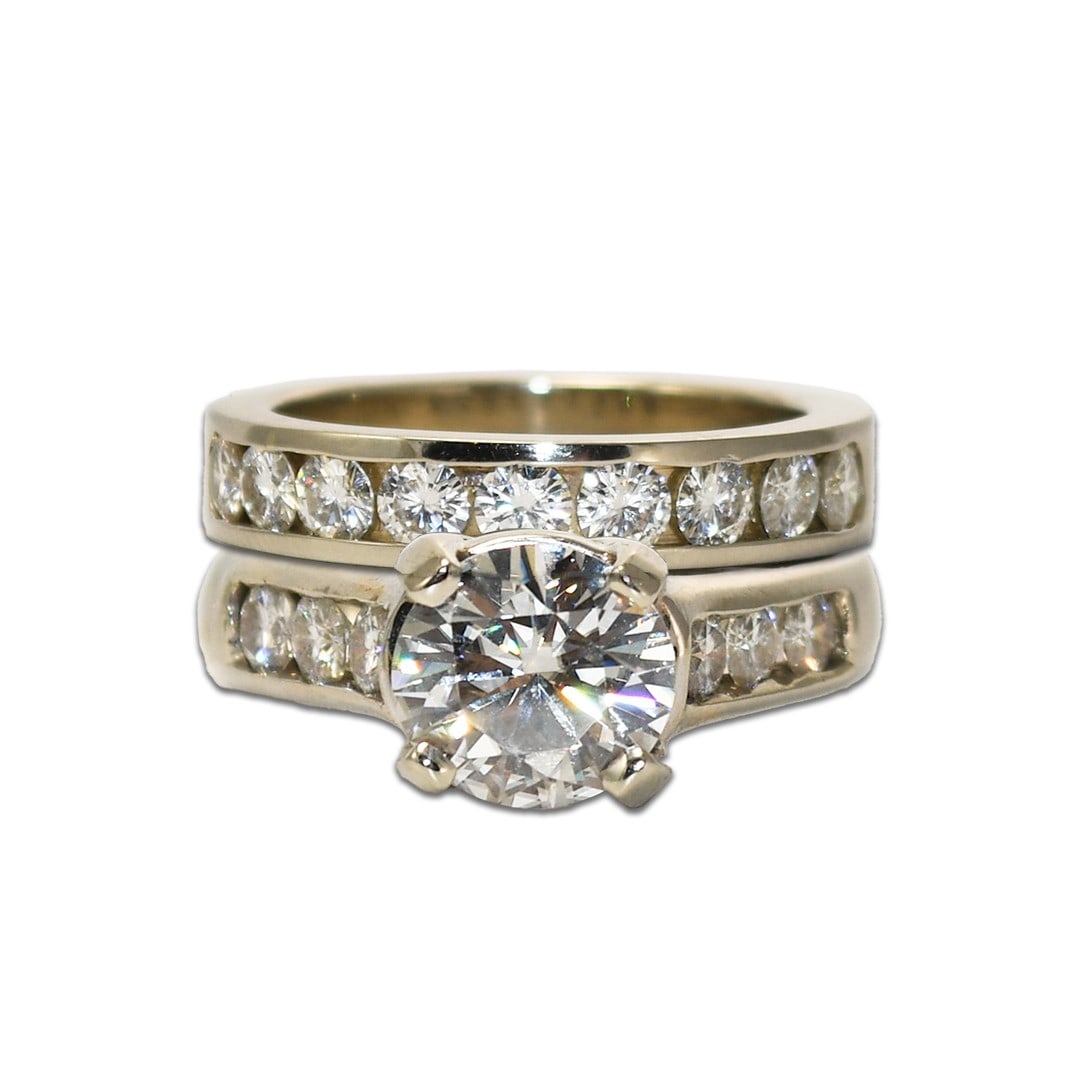 Moissanite engagement wedding ring set 14k white gold size 7: Moissanite engagement wedding ring set 14k white gold size 7 This pre-owned wedding and engagement ring set is crafted from 14k white gold and features moissanite stones. The engagement ring has a cen