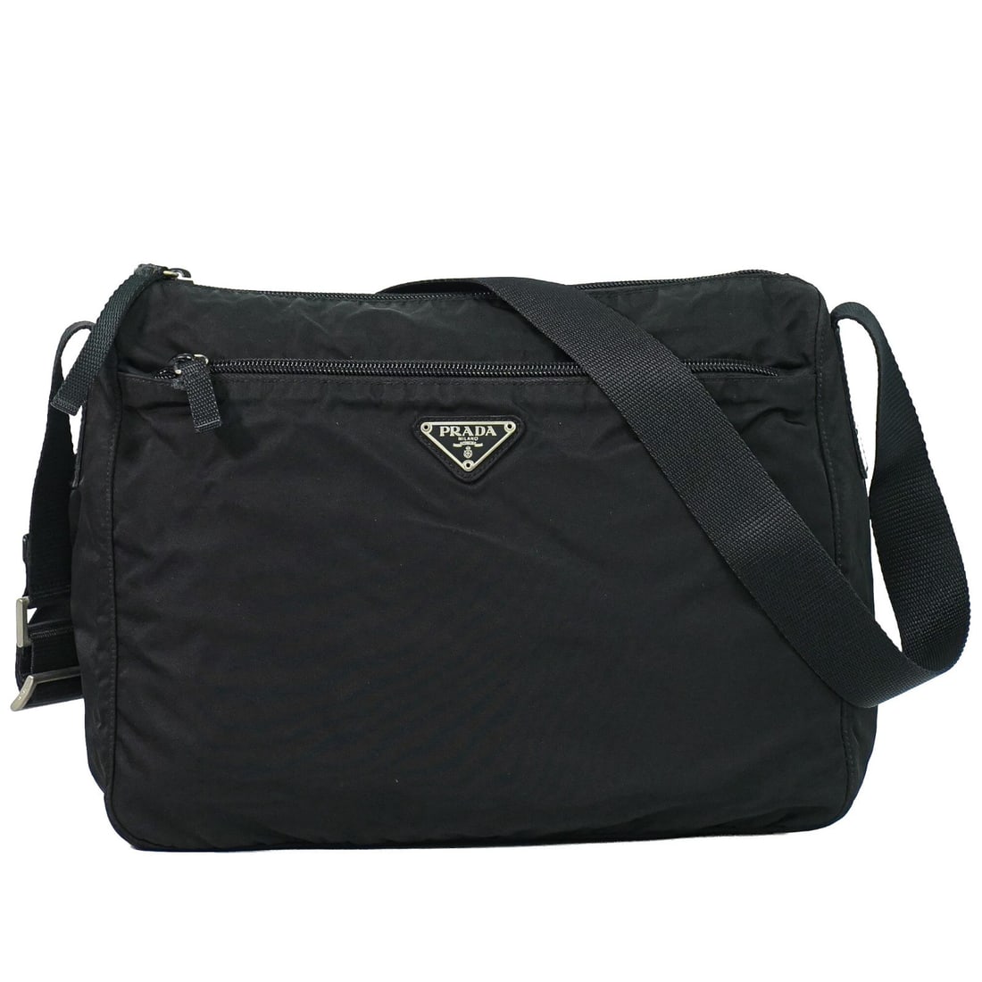 Prada Tessuto Black Nylon Messenger Bag with Front Zip: Prada Tessuto Black Nylon Messenger Bag with Front Zip This Prada Front Zip Messenger Bag is crafted from durable black nylon and features a front zip design. Suitable for unisex use, the bag offers a