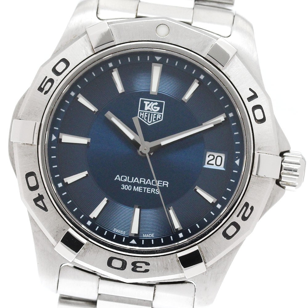 TAG Heuer Aquaracer Quartz Date Men's Stainless Steel Watch WAP1112: TAG Heuer Aquaracer Quartz Date Men's Stainless Steel Watch WAP1112 This TAG Heuer Aquaracer Date Quartz men's wristwatch features a stainless steel case and bracelet with a navy dial. The watch is po