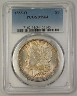 PCGS MS64 1885 O Morgan Silver Dollar: PCGS MS64 1885 O Morgan Silver Dollar This 1885-O US Morgan Silver Dollar features attractive toning and has been professionally graded MS-64 by PCGS. The coin is in pre-owned condition and offers col