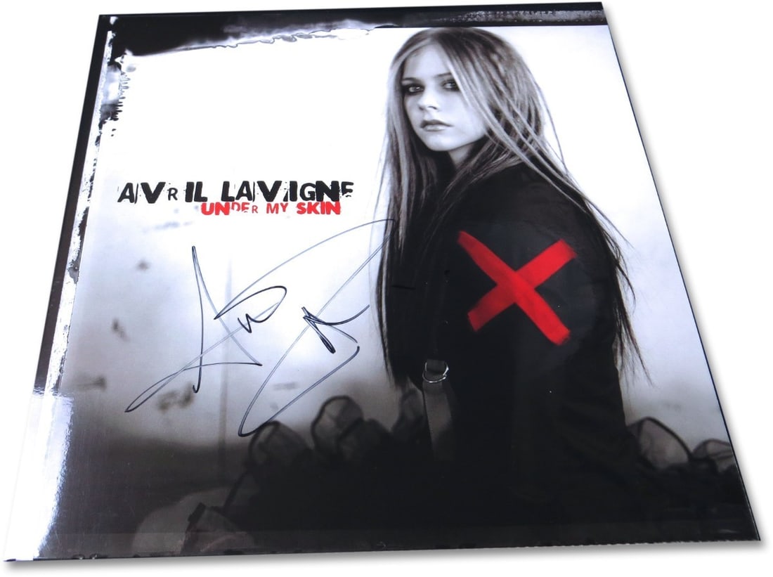 Avril Lavigne Autographed Under My Skin Album Cover Beckett Authenticated: Avril Lavigne Autographed Under My Skin Album Cover Beckett Authenticated This Avril Lavigne autographed record album cover from her iconic album 'Under My Skin' is a must-have for fans and collectors