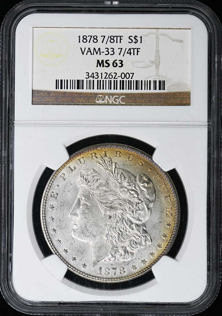 NGC MS63 1878 Morgan Dollar VAM-33 7 4TF Philadelphia Mint: NGC MS63 1878 Morgan Dollar VAM-33 7 4TF Philadelphia Mint This is an 1878 Morgan Dollar featuring the 7/8 Tail Feathers (7/4TF) VAM-33 variety. Graded MS63 by NGC, this uncirculated coin was minted i