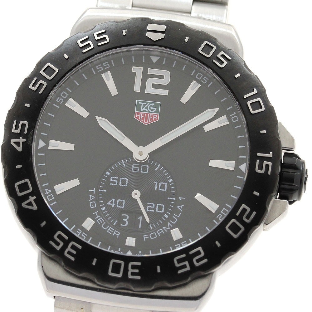 TAG Heuer Formula 1 Quartz Date Men's Stainless Steel Watch WAU1110: TAG Heuer Formula 1 Quartz Date Men's Stainless Steel Watch WAU1110 This TAG Heuer Formula 1 Date Quartz men's wristwatch features a stainless steel case and bracelet with a black dial. It is equipped