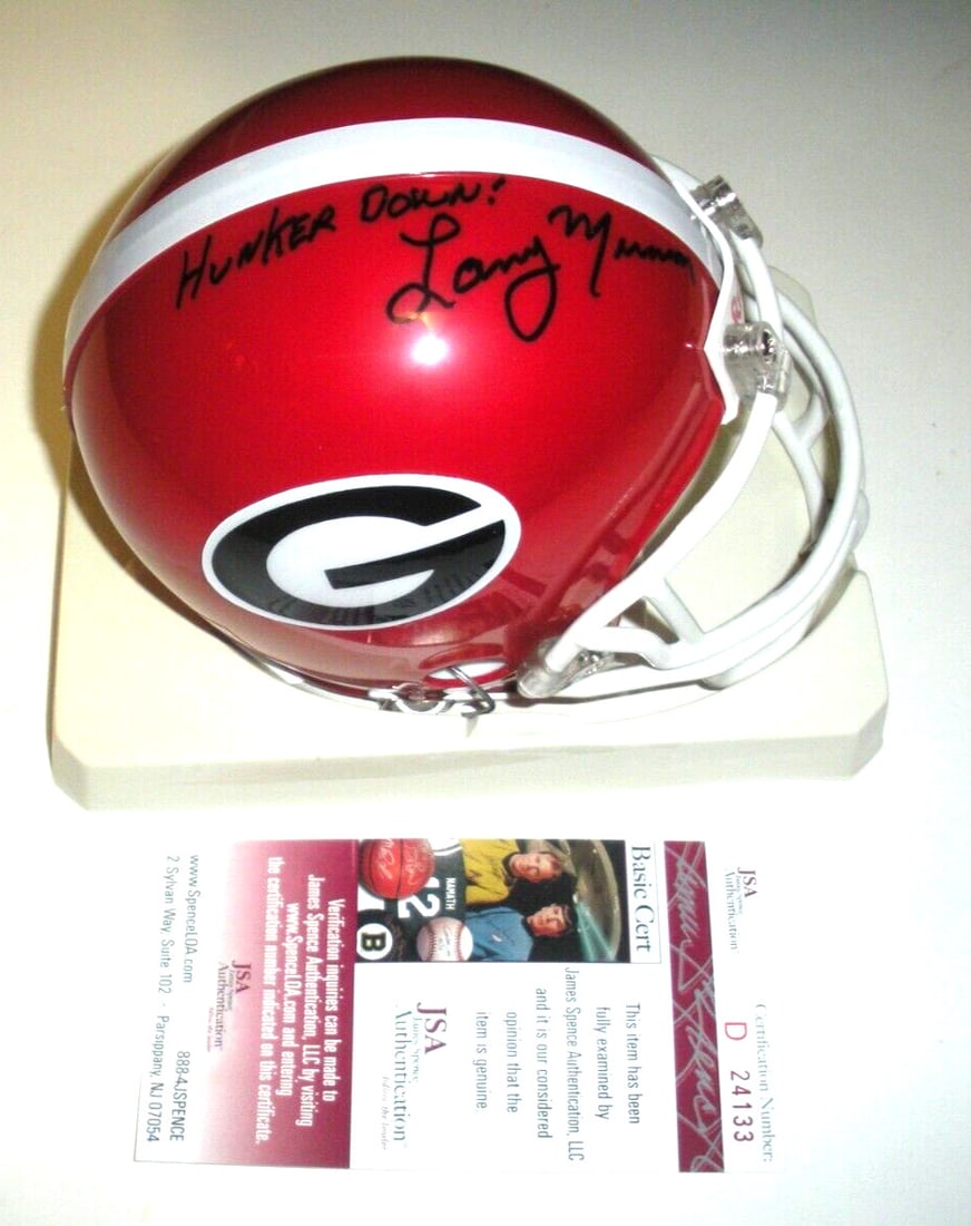 Signed Georgia Bulldogs Mini Helmet Larry Munson With JSA COA: Signed Georgia Bulldogs Mini Helmet Larry Munson With JSA COA This pre-owned Georgia Bulldogs mini helmet is an original item signed by Larry Munson. It includes JSA/COA authentication, making it a va